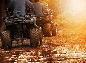 couple riding atvs covered by specialty insurance