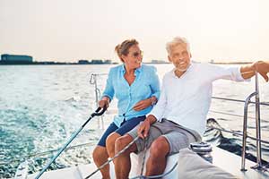 elderly couple relaxing on their boat covered by boat insurance
