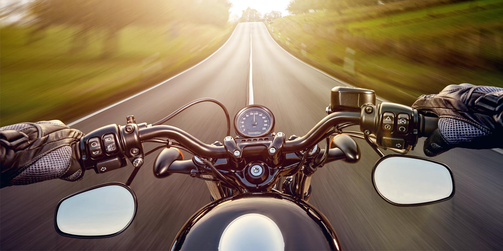 a man riding his motorcycle on the road with motorcycle insurance coverage