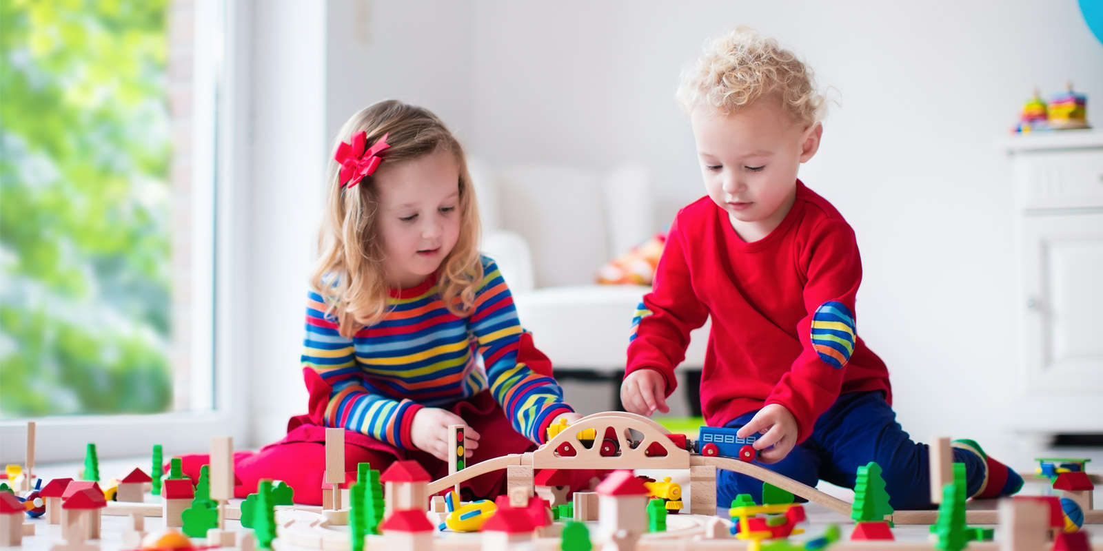 two kids playing at a daycare that is covered by daycare insurance