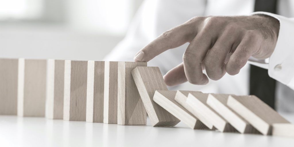 Hand stopping blocks falling over