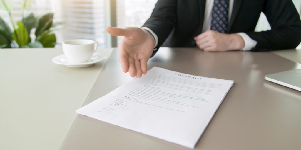 Insurance agent showing contract coverage