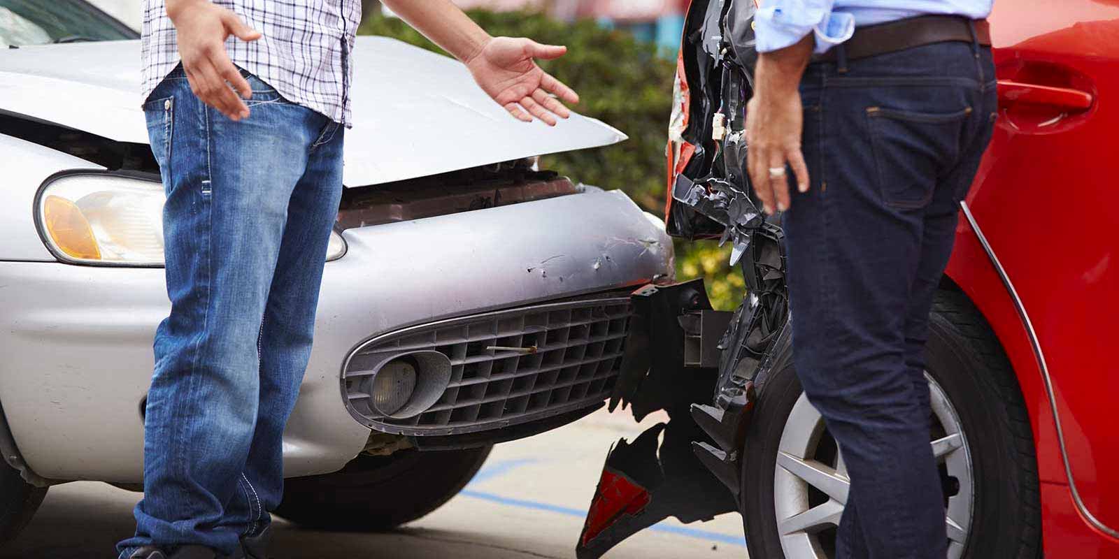 two-people-confronting-each-other-after-a-car-accident-who-needs-coverage-from-commercial-auto-insurance
