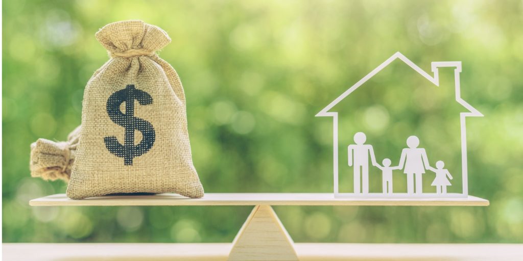 a bag, family members live inside a house on basic balance scale, depicts the benefits of flood insurance for homeowners