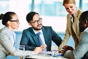 Business insurance agent talking to clients