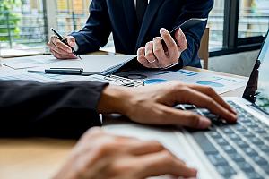 Rental property insurance agent with client 