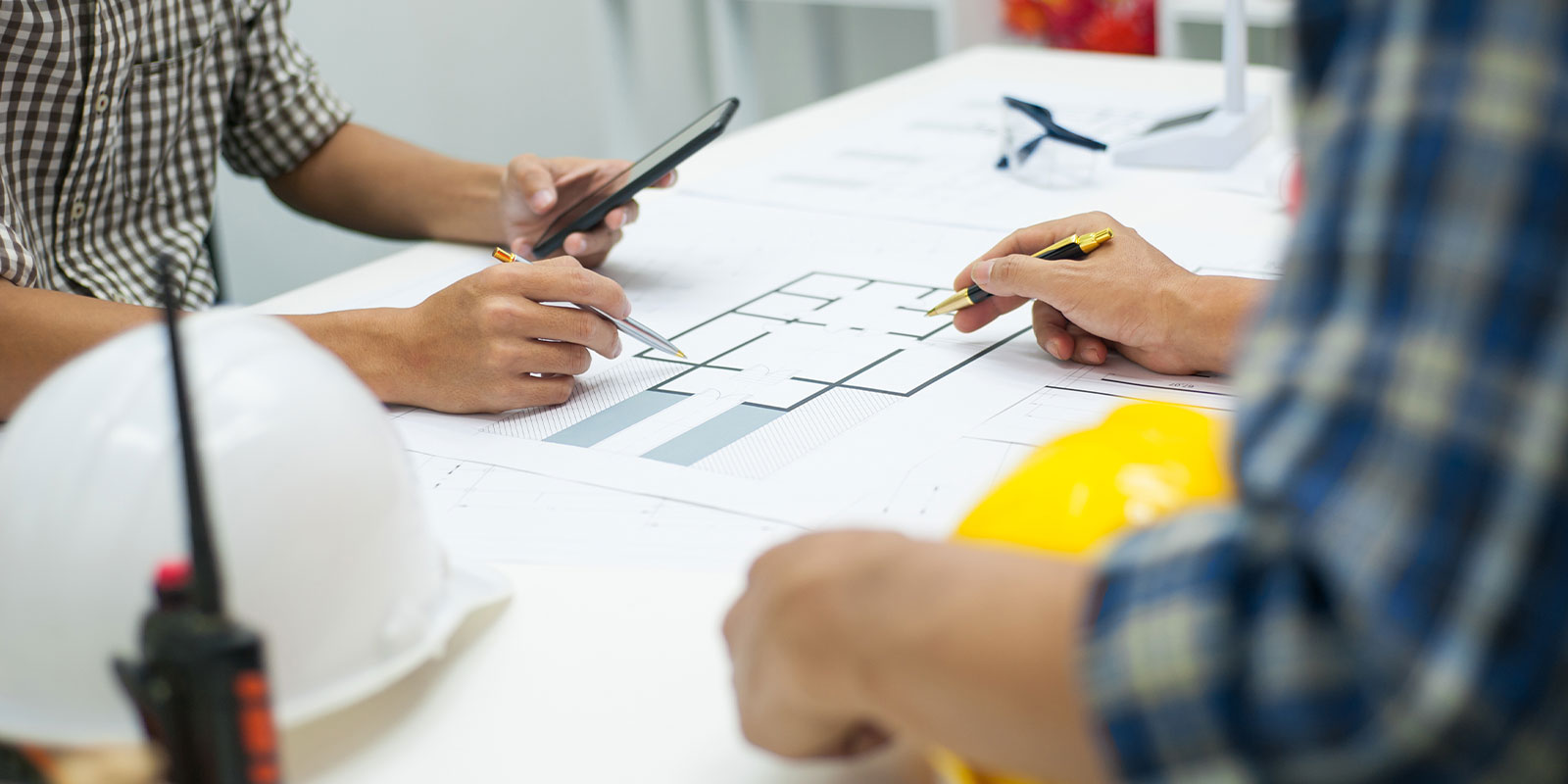 two contractors looking at work for upcoming home