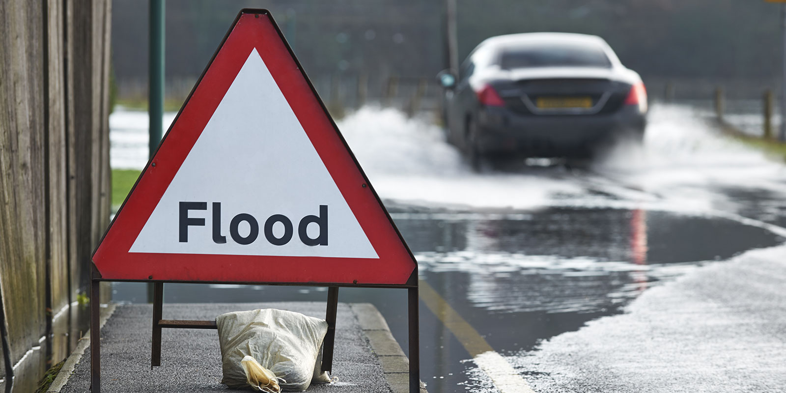 flood sign giving warning for Flood Insurance Requirements For Commercial Property