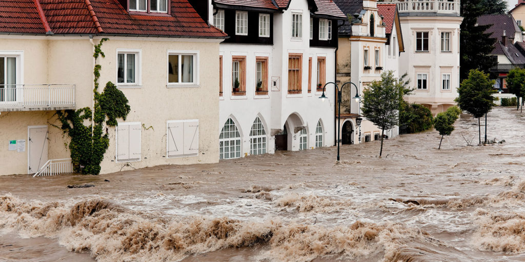 a row of building that are getting Commercial Flood Insurance