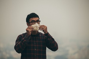 Man Wearing Mask in Pollution