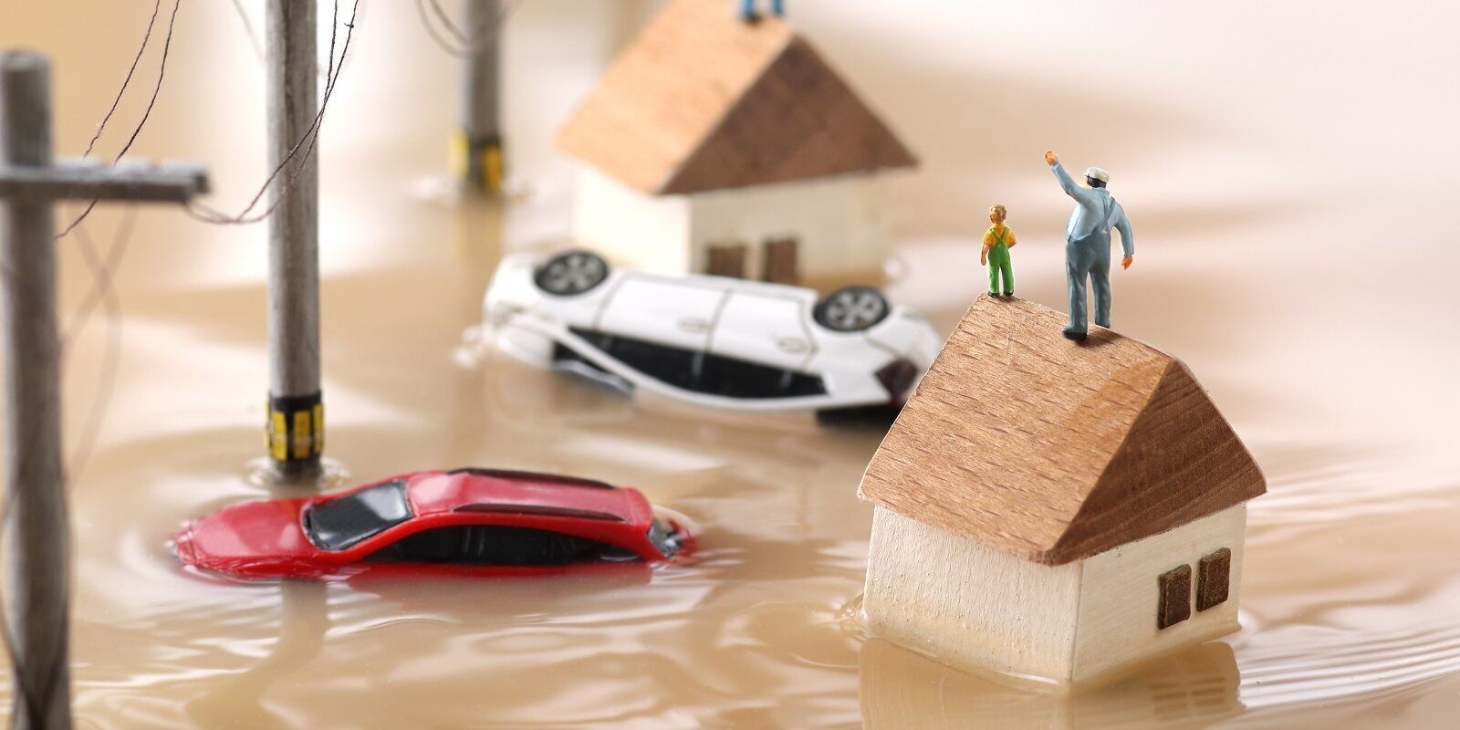 landscape of houses flooded by floods and people waiting for rescue