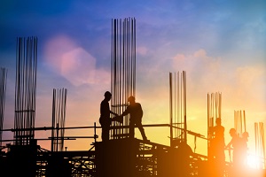 engineer and construction team working at site with construction insurance