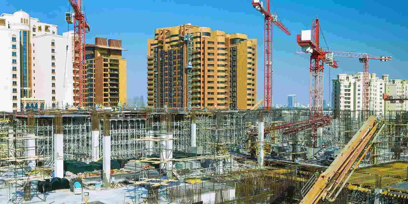 big machines building a city