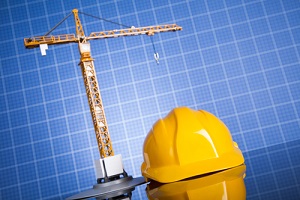 building and cranes under construction with Construction Insurance