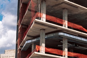 new building work against blue sky after knowing construction insurance cost