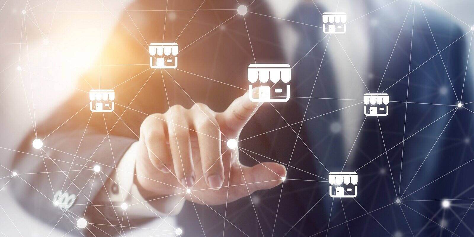 businessman hand touching icon franchise marketing system in global network connection