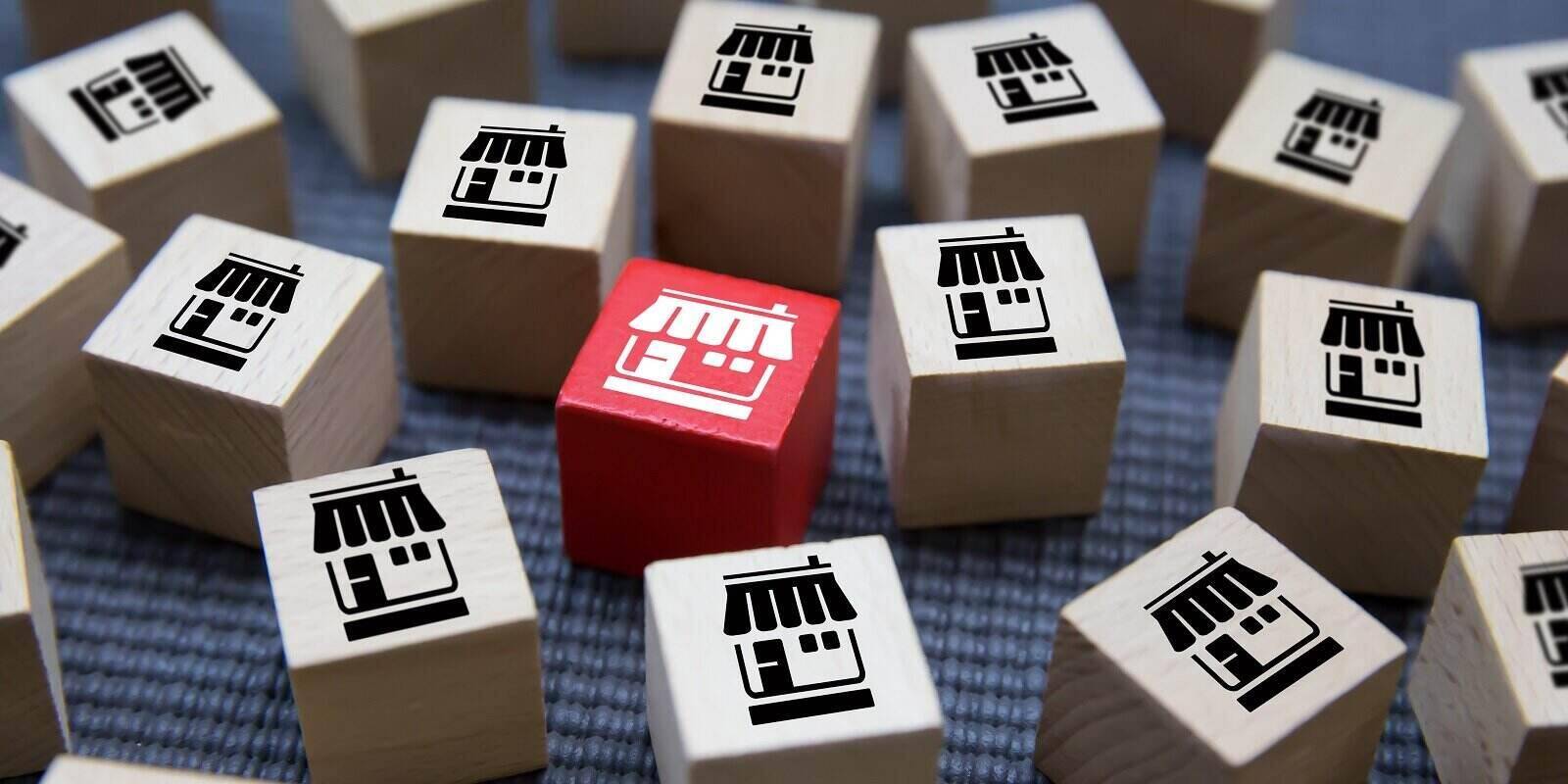 franchise business on Cubes wood concept or wooden blog with franchise marketing store icons