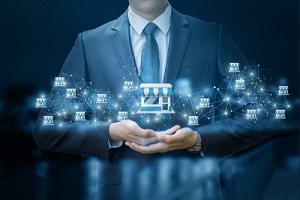 businessman showing Franchise system on a mobile device for general liability insurance