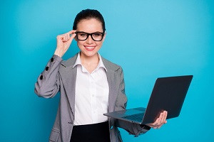 portrait of nice cheerful skilled lady insurance expert holding in hand laptop