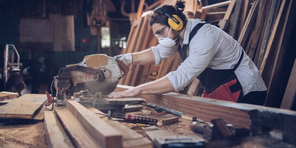 carpenter furniture hand cuting man factory industry manufacturer