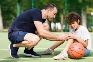 school boy injured during playing basketball