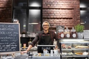small restaurant owner in the counter