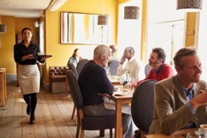 waitress taking order in busy restaurant