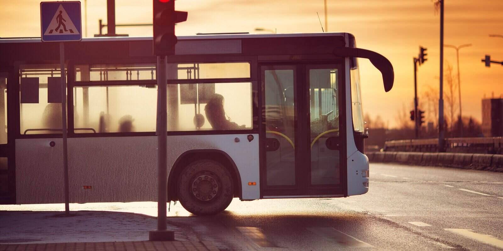 bus moving on the road in city in early morning