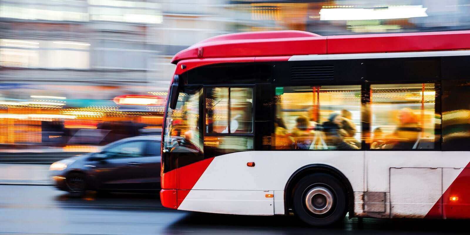 picture of a bus in city traffic in motion blur