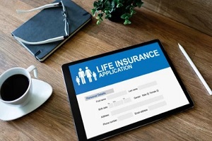 man checking life insurance application form