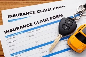insurance claim form with car key