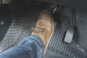 man applying car brake