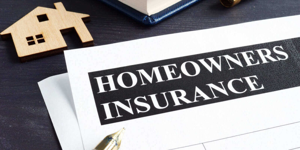homeowners insurance policy and model of home