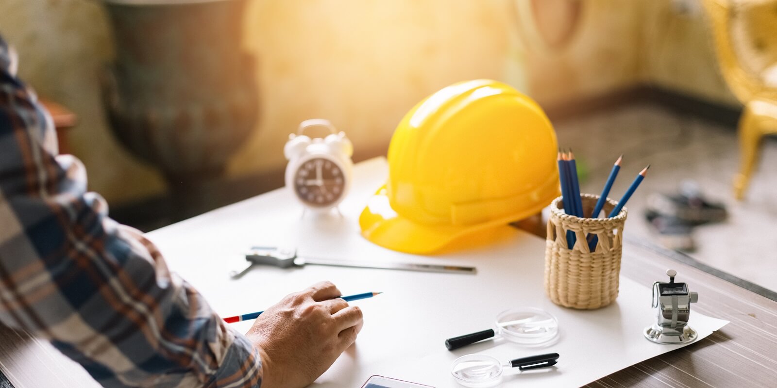 contractor sketching a construction project