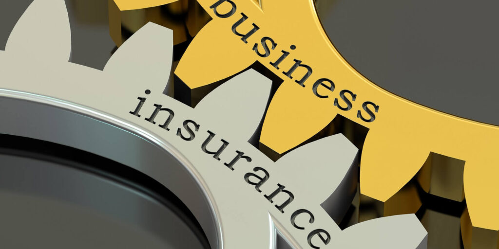 business insurance concept on the gearwheels