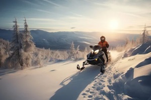 man riding a snowmobile against sun