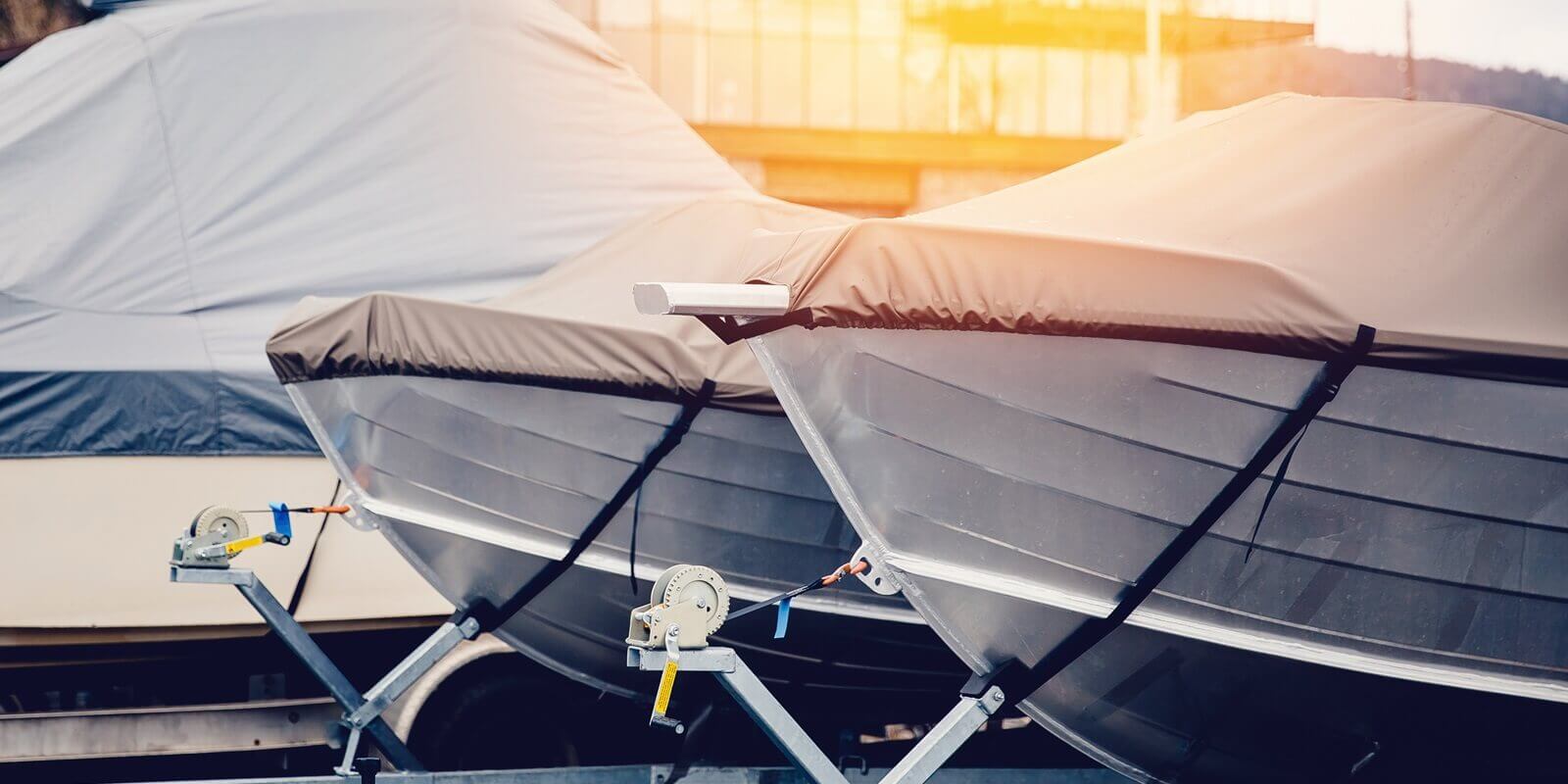 row of boats in storage for the winter under the awning