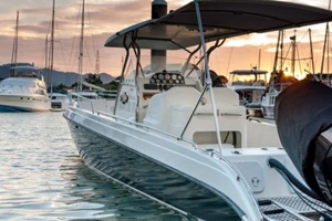 small motorboat docking at the marina at sunset time