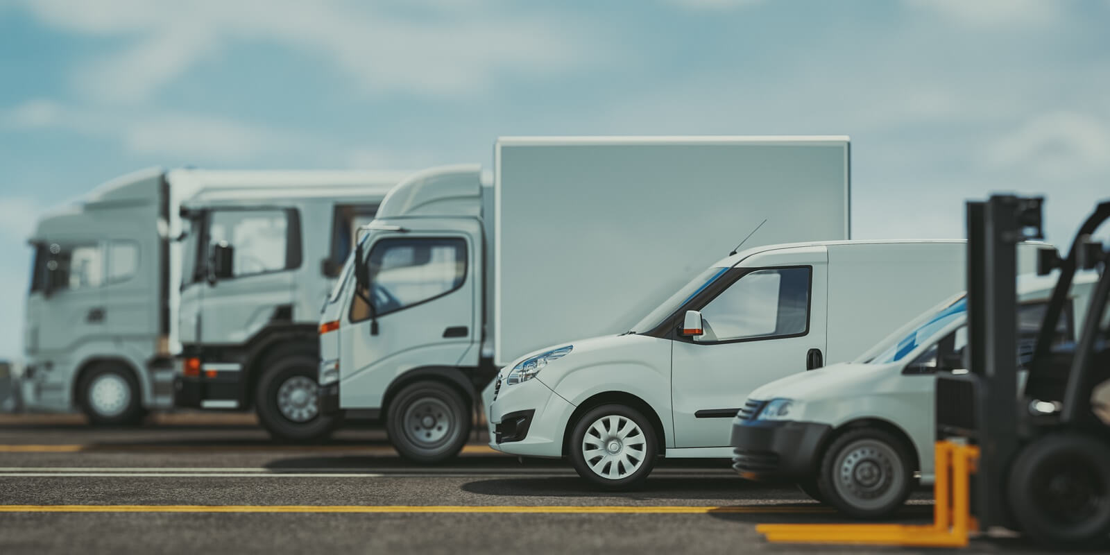 trucks of various sizes on the road