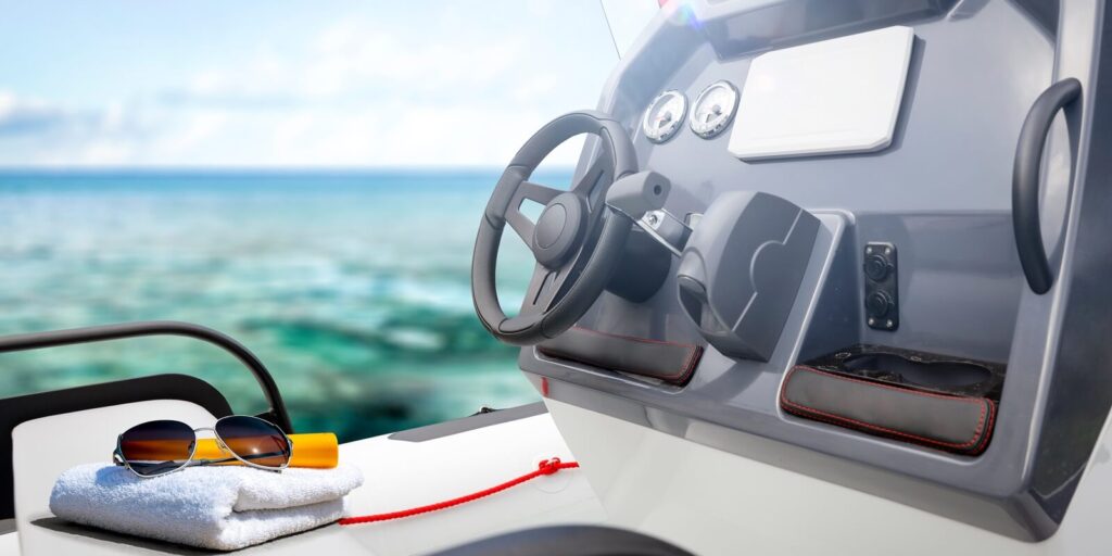 white towel and summer sunglasses on boat