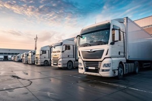 close up fleet of trucks parked in front of warehouse to delivering factory goods