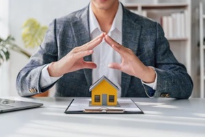 lawsuits against Real estate agent and realtor general liability insurance businessman professional discussing and consultant with house toy model building
