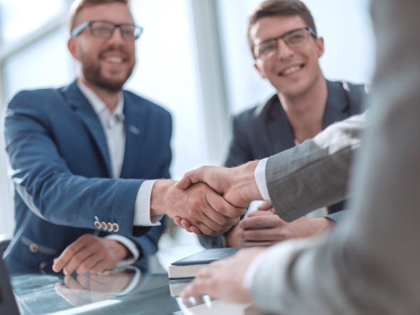 close up. successful business people shaking hands . concept of cooperation
