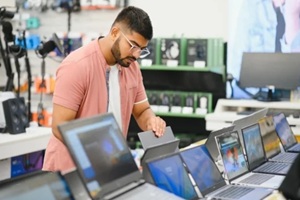 man checking laptop products