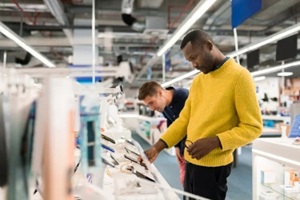 people shopping in an electroinc store