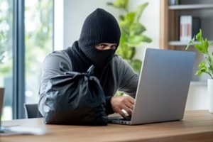 cybercriminal using laptop