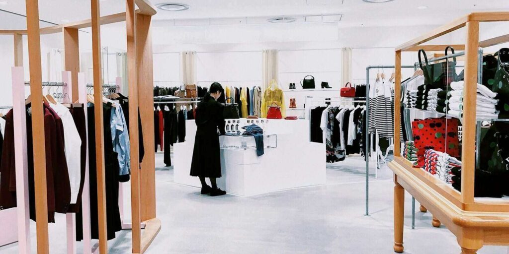 woman standing inside clothing area