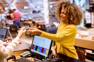 women making payment at a store