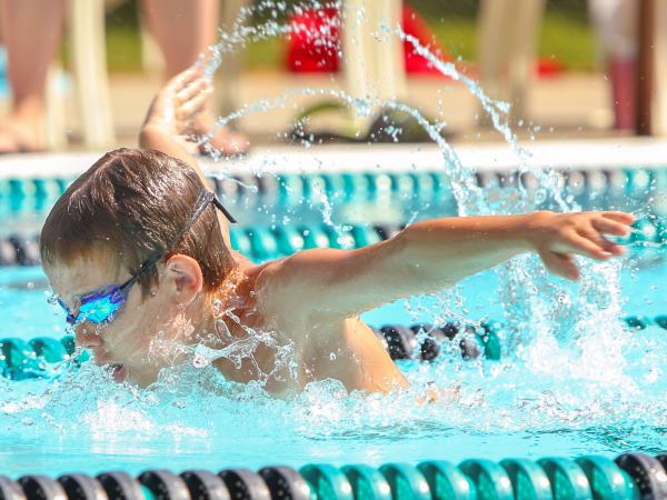 Boy swimming Butterfly in a race