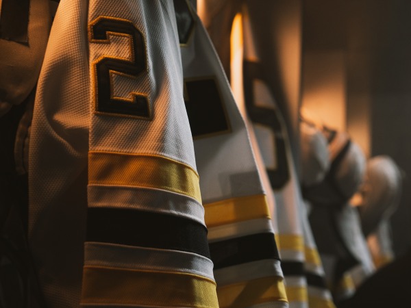 ECU View of ice hockey team uniform hanging in a changing room